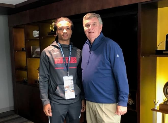 Hill poses with Paul Johnson on Monday during his visit