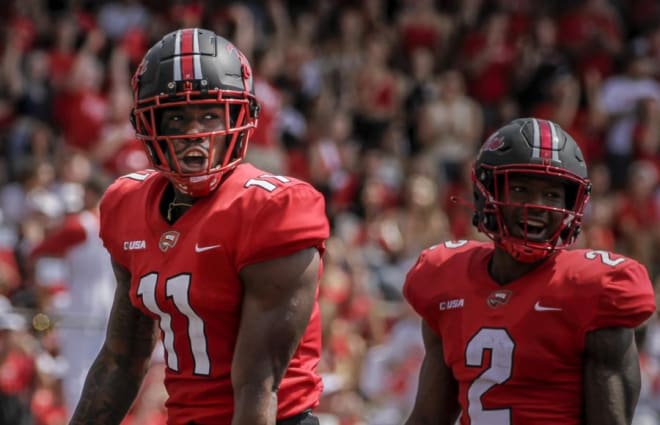 Malachi Corley (11) and Davion Ervin-Poindexter (2) celebrate a touchdown pass from QB Austin Reed