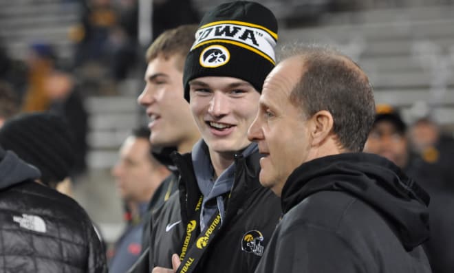 Scott Nelson talks with Iowa defensive coordinator Phil Parker during his official visit.