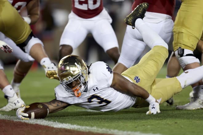 Notre Dame running back Gi'Bran Payne's lunge toward the goal line was originally ruled a fumble, but replay overturned the call and rules it a Notre Dame TD Saturday at Stanford.