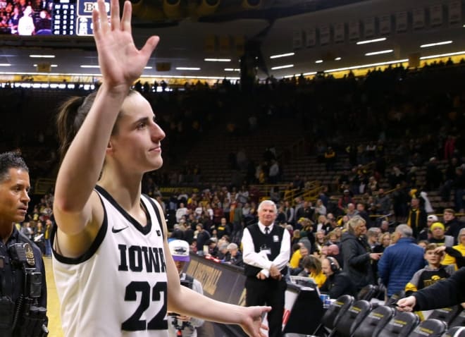 Caitlin Clark waves to the crowd as she exits the court after the Minnesota game Saturday, Dec. 30, 2023 at Carver-Hawkeye Arena