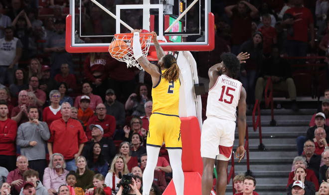 UNC Greensboro transfer Mikeal Brown-Jones dunks the ball during a 78-72 win over Arkansas on Nov. 17.