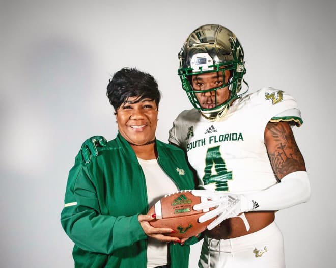 Clemmons and his mother pose at USF