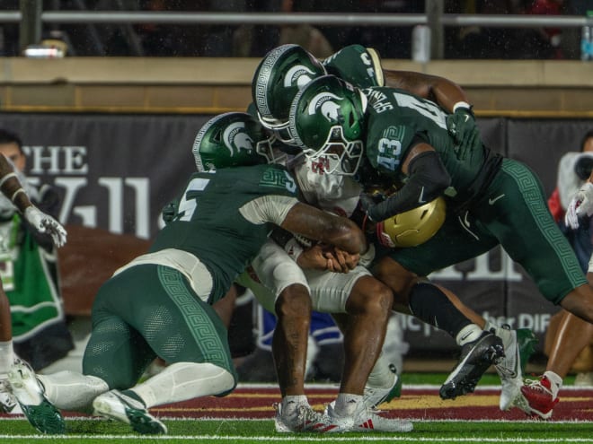 Michigan State defenders wrap up a Boston College player at Alumni Stadium on Sept. 21, 2024.