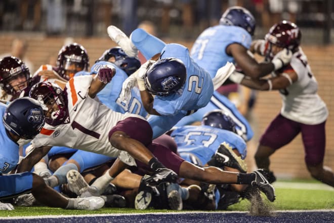 Old Dominion running back Blake Watson (2) scores a go-ahead TD against Virginia Tech.