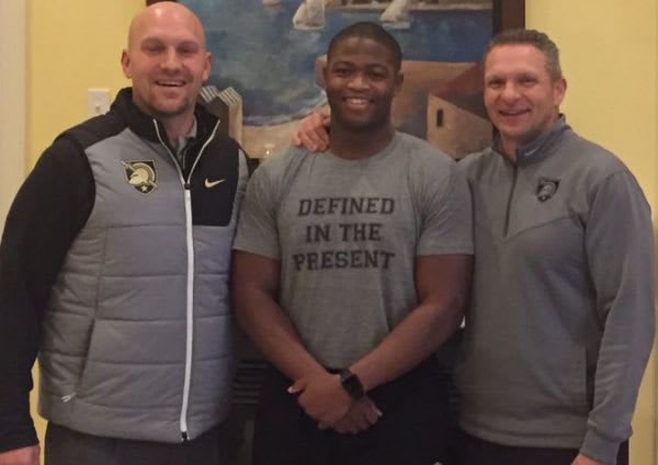 LB Arik Smith is joined by Army D-line coach Chad Wilt and head coach Jeff Monken during Monday's home visit