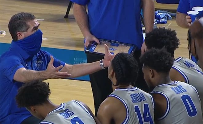 Coach Nick McDevitt talks with his team during timeout near the end of the game. (Photo credit to espn.com/watch) 