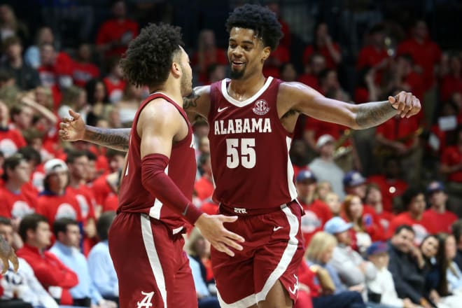 Alabama Crimson Tide guard Aaron Estrada (55) embraces with guard Mark Sears (1) during the second half against the Mississippi Rebels at The Sandy and John Black Pavilion at Ole Miss. Photo | Petre Thomas-USA TODAY Sports