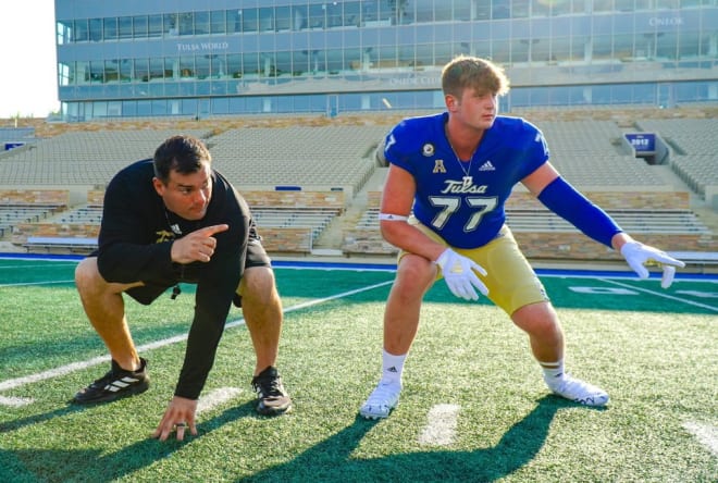 Bixby OL Brody Duffel with Tulsa OL coach Ryan Stanchek during an unofficial visit.