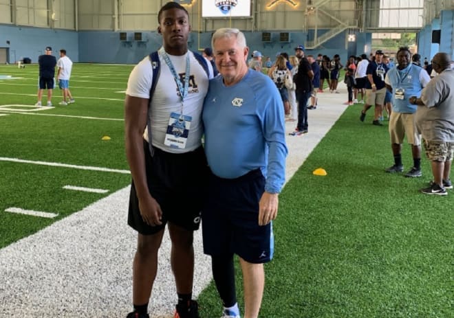 Mack Brown, pictured with current UNC Keesahwn Silver in 2019, sees commitments soon picking up.
