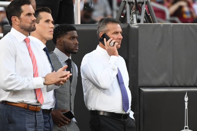 Meyer's presence added an interesting layer to the proceedings as many fans have pined for him to be USC's next head coach and win another of those national championship rings, like the one he wore Friday night.