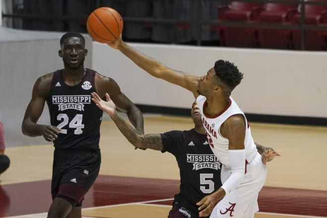 Alabama Crimson Tide forward Keon Ambrose-Hylton (22) grabs a pass against Mississippi State Bulldogs guard Deivon Smith (5) during first half at Coleman Coliseum. Photo | Imagn