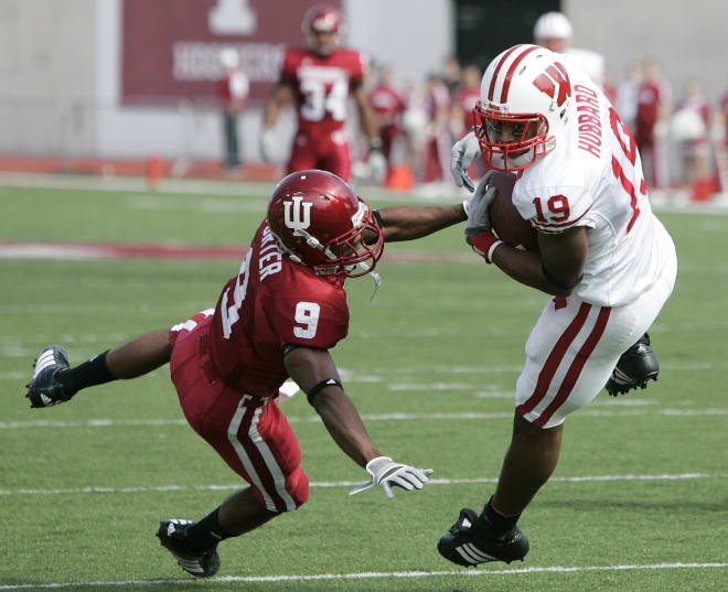 Wisconsin wide receiver Paul Hubbard, right, makes a catch while being defended by Indiana cornerback Tracy Porter on Sept. 30, 2006. UW won 52-17.