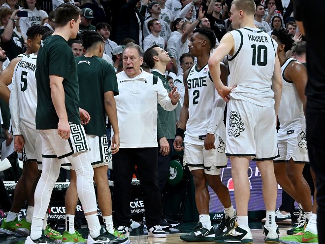 Michigan State head coach Tom Izzo talks with his team versus Michigan