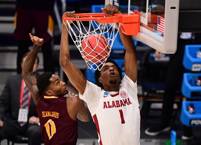 Alabama Crimson Tide forward Herbert Jones (1) dunks over Iona Gaels guard Berrick JeanLouis (0) during the first round of the 2021 NCAA Tournament at Hinkle Fieldhouse. Photo | Imagn