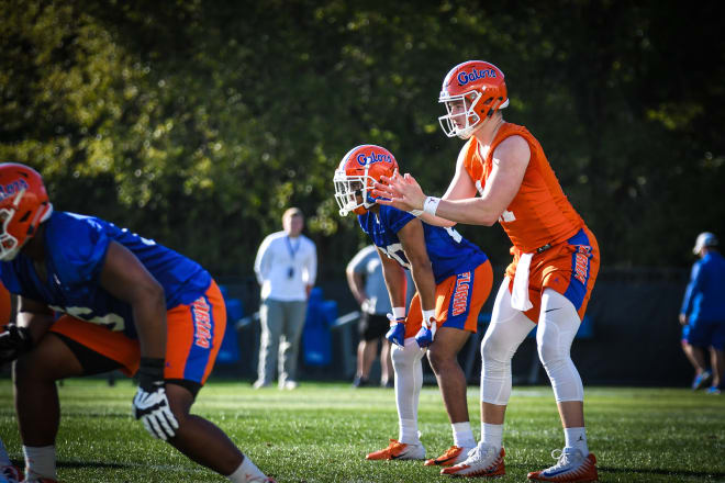 Florida quarterback Kyle Trask (right) and running back Malik Davis (middle). 