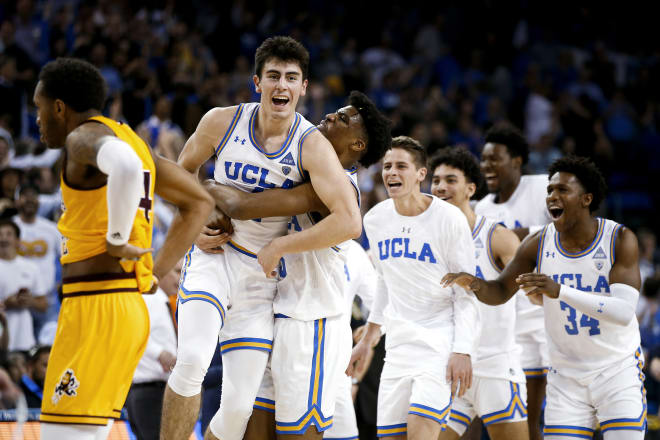 UCLA moved into first place on a last-second shot by Jaime Jacquez on Thursday.