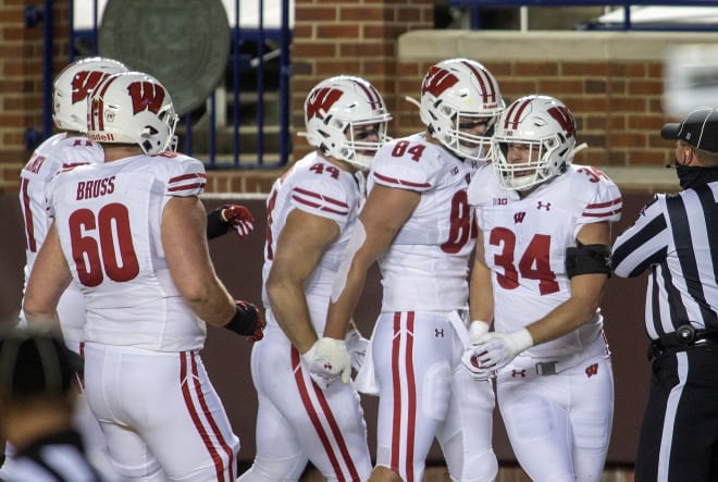 Wisconsin fullback Mason Stokke (34) celebrates his touchdown with teammates in the first quarter.