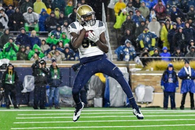 Navy Midshipmen wide receiver Craig Scott (82) catches a pass for a touchdown in the third quarter against the Notre Dame Fighting Irish at Notre Dame Stadium. 