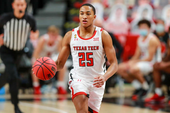 Guard Nimari Burnett #25 of the Texas Tech Red Raiders handles the ball during the first half of the college basketball game against the Northwestern State Demons at United Supermarkets Arena on November 25, 2020 in Lubbock, Texas