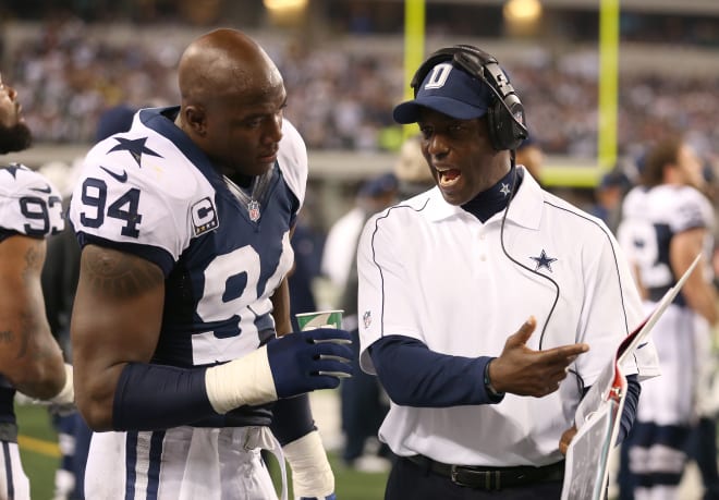 Baker during his time with the Dallas Cowboys coaching Demarcus Ware