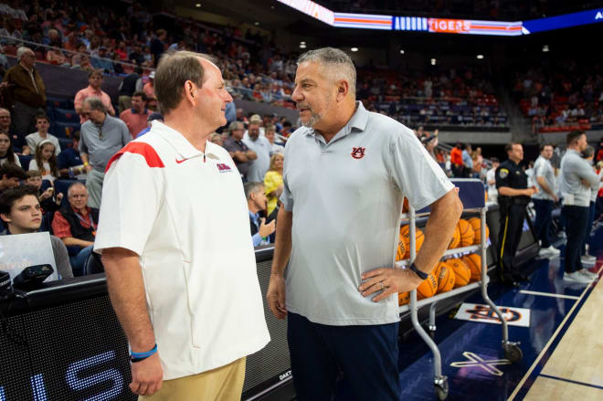 Former Ole Miss Rebels head coach Kermit Davis and Auburn Tigers head coach Bruce Pearl talk before Auburn Tigers take on Ole Miss Rebels at Neville Arena in Auburn, Ala., on Wednesday, Feb. 22, 2023 Jake Crandall-USA TODAY NETWORK