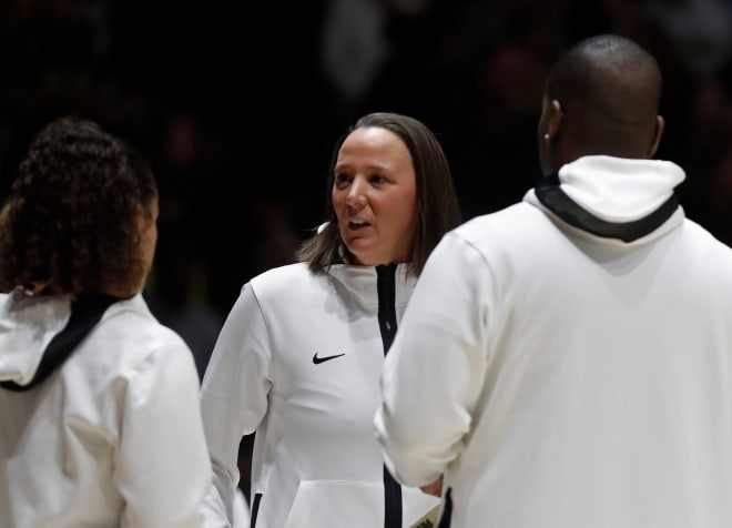 Purdue Boilermakers head coach Katie Gearlds huddles with the coaching staff during of the NCAA women s basketball game against the Iowa Hawkeyes, Wednesday, Jan. 10, 2024, at Mackey Arena in West Lafayette, Ind.