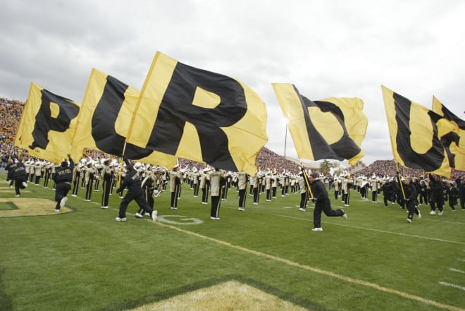 Oct 16, 2004; West Lafayette, IN, USA; Purdue University cheerleaders carry the flags on the field prior to opening kick-off against University of Wisconsin. Badgers beat the Boilermakers 20-17. Mandatory Credit:Photo by Matthew Emmons-USA TODAY Sports (©) Copyright 2004 by Matthew Emmons