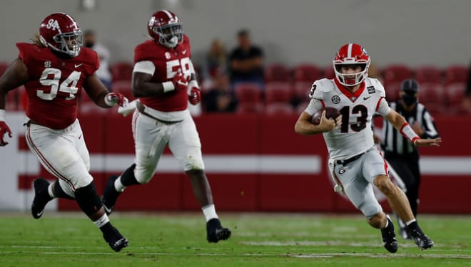 Kirby Smart wants Stetson Bennet to stop carrying the ball in one arm.