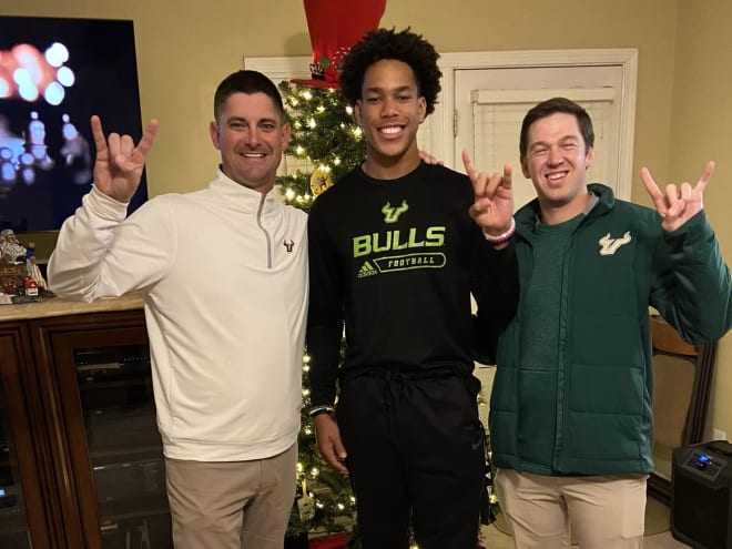 USF head coach Jeff Scott, Brown and offensive coordinator Charlie Weis Jr. 