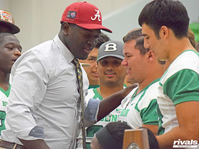 Vernon Jackson celebrates with teammates after announcing his commitment to Alabama on Friday afternoon.