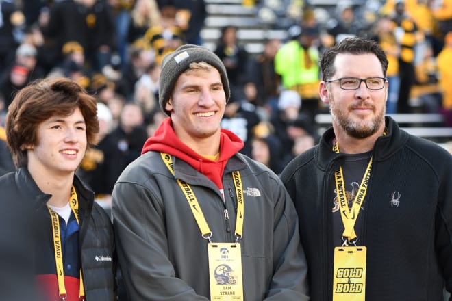 Davenport Central LB/DE Sam Strang, center, visited the Iowa Hawkeyes this past weekend.