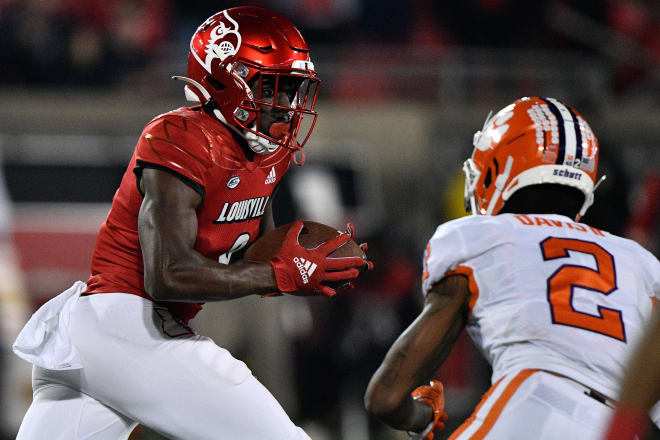 Louisville Cardinals wide receiver Tyler Harrell (8) runs the ball against Clemson Tigers cornerback Fred Davis II (2) during the second half at Cardinal Stadium. Clemson defeated Louisville 30-24. Photo | Jamie Rhodes-USA TODAY Sports