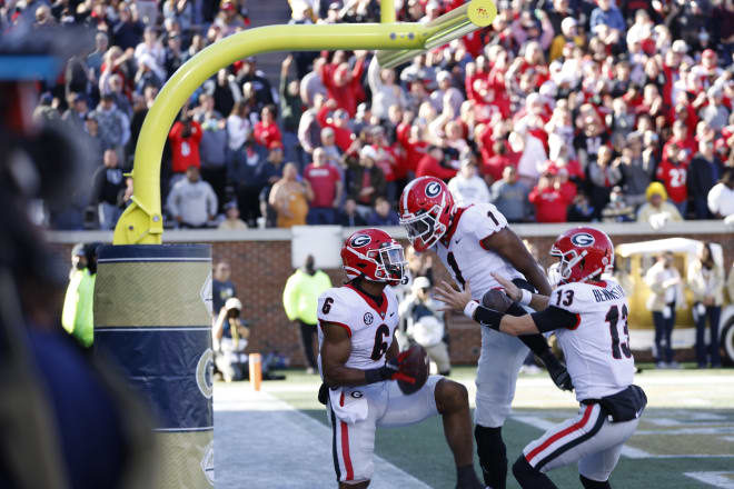 Kenny McIntosh, George Pickens and Stetson Bennett celebrate after a touchdown. (Andrew Davis Tucker/UGA Sports Communications)