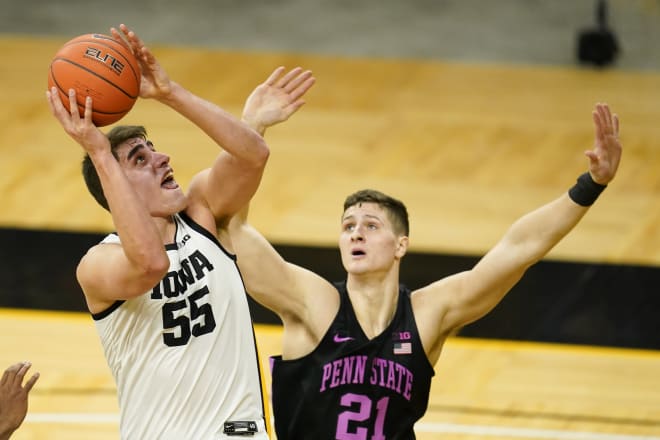 Iowa center Luka Garza rises for a shot against Penn State's John Harrar 