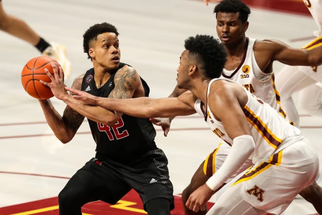Mar 6, 2021; Minneapolis, Minnesota, USA; Rutgers Scarlet Knights guard Jacob Young (42) in action while Minnesota Golden Gophers forward Eric Curry (24) defends in overtime at Williams Arena.