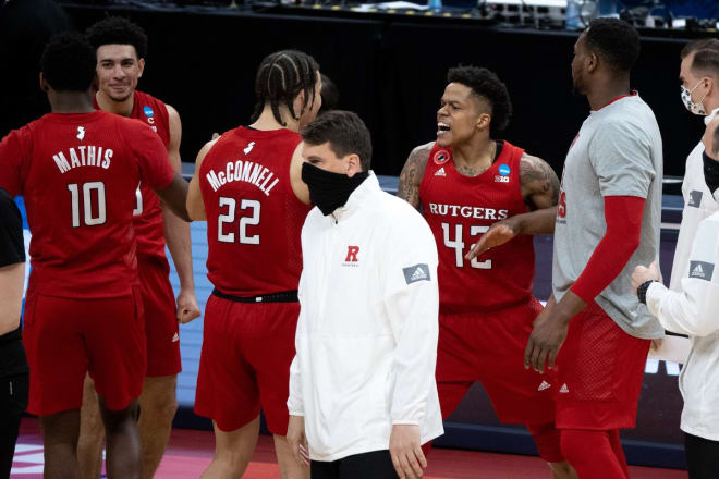 Rutgers players celebrate their 60-56 victory over Clemson during the first round of the 2021 NCAA Tournament on Friday, March 19, 2021, at Bankers Life Fieldhouse in Indianapolis, Ind. 