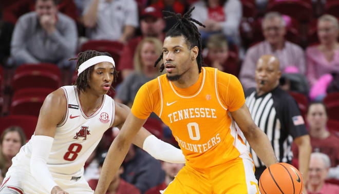 Former Arkansas forward Chandler Lawson guards Tennessee center Jonas Aidoo on Feb. 14 at Bud Walton Arena in Fayetteville. Aidoo is currently in the transfer portal and considering Arkansas.