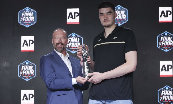 Apr 1, 2023; Houston, TX, USA; Purdue center Zach Edey is presented with the Associated Press player of the year trophy at a press conference at NRG Stadium. Mandatory Credit: Troy Taormina-USA TODAY Sports