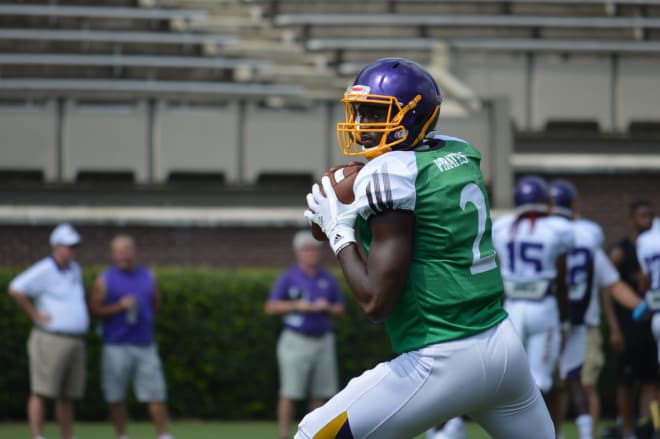 Redshirt freshman quarterback Kingsley Ifedi loads up in the pocket in Saturday's first scrimmage in Dowdy-Ficklen Stadium.