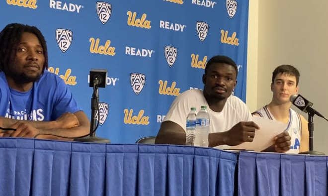 Kenneth Nwuba, Adem Bona and Lazar Stefanovic talk after UCLA’s season-opening win Monday night.