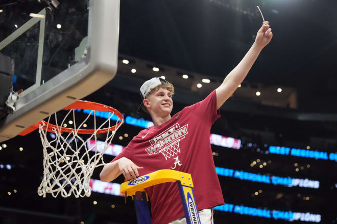 Alabama Crimson Tide forward Sam Walters (24) cuts the net after defeating the Clemson Tigers in the finals of the West Regional of the 2024 NCAA Tournament at Crypto.com Arena. | Photo: Kirby Lee-USA TODAY Sports