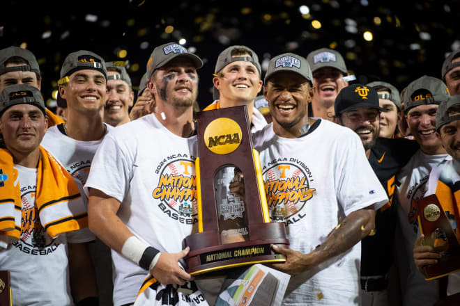 Tennessee's Blake Burke and Christian Moore hold the trophy after game three of the NCAA College World Series finals between Tennessee and Texas A&M at Charles Schwab Field in Omaha, Neb., on Monday, June 24, 2024.
