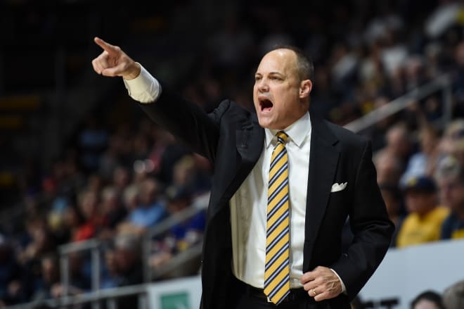 Mark Fox directing his players against Utah. 