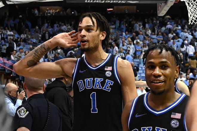 Duke's Dereck Lively II, left, and Jeremy Roach leave the court after Duke's win at UNC. 