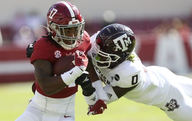 Alabama wide receiver Jaylen Waddle (17) runs after making a catch while Texas A&M defensive back Myles Jones (0) makes the tackle at Bryant-Denny Stadium. Photo | Imagn