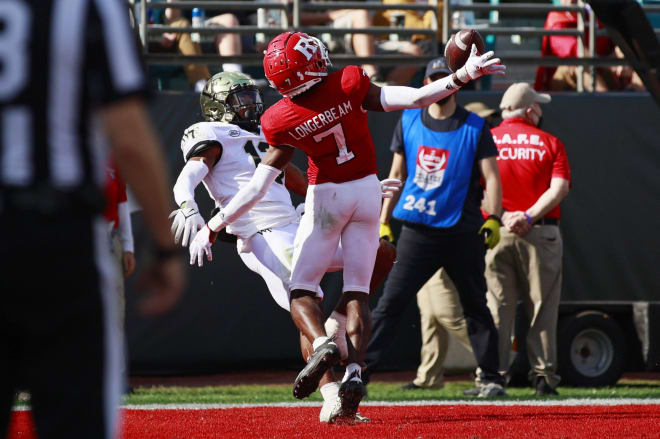 Wake Forest Demon Deacons wide receiver Ke'Shawn Williams (13) can't haul in a reception as Rutgers Scarlet Knights defensive back Robert Longerbeam (7) defends against a potential touchdown during the third quarter Friday, Dec. 31, 2021 at TIAA Bank Field in Jacksonville. 