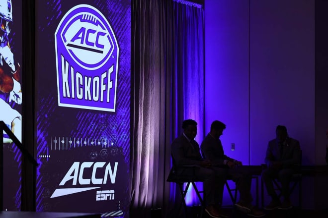 FSU players Jordan Travis, McKenzie Milton and Jermaine Johnson wait to speak with the media at the 2021 ACC Kickoff in Charlotte, N.C..