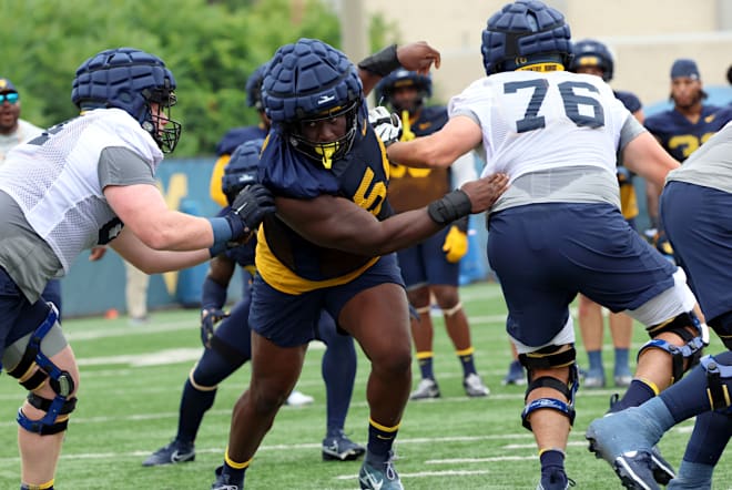 The West Virginia Mountaineers football program are bigger up front at nose.