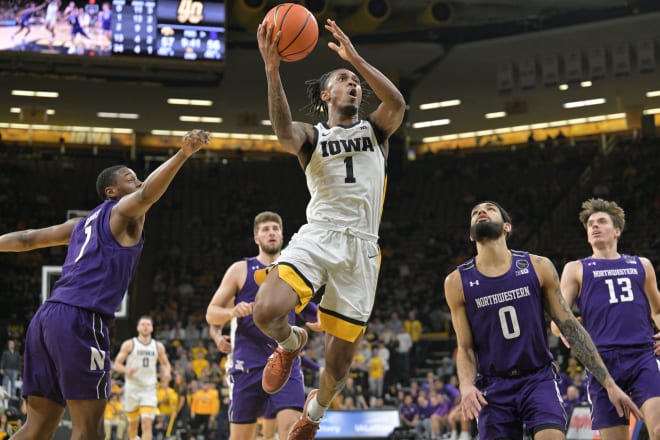 Ahron Ulis weaves through traffic against Northwestern earlier this season. 